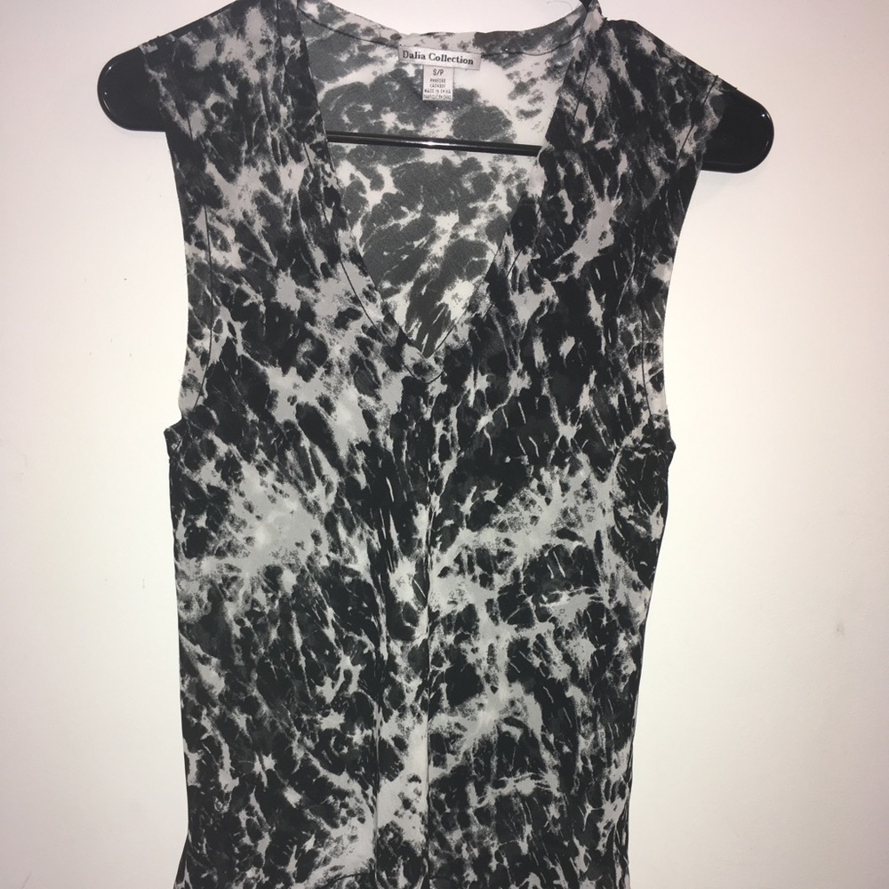 See threw Black and white V-neck flowy blouse.